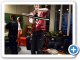 008 A physics student demonstrates conservation of angular momentum