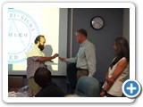 005 Professor David Dunlap gives a pen to Ezequiel Carrasco during his induction into the Physics Honor Society, Sigma Pi Sigma as Professor Mousumi Roy looks on.