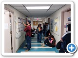 Students crowd the building halls in between tours