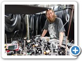 Grad student Andrew Ferdinand manipulating laser light with atoms (Becerra-Chavez)