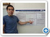 Grad student Bob Keating displays a poster with research conducted in conjunction with Sandia National Labs. (Deutsch)