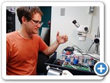 Grad student Michael Treiman building a relay switch system for the spectrophotometer heat switch (Boyd)