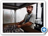 Optical Science and Engineering grad student Farzin Farzam with a structured illumination microscope (Lidke)