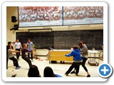 Two teams of audience members pulling on opposite sides of Magdeburg hemispheres (illustrating the principles of air pressure).