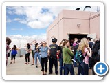 Visitors lined up to see the eclipse on the screens inside the UNM Campus observatory 