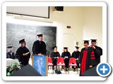 Dissertation Director Wolfgang Rudolph ceremoniously hoods Yejia Xu, new PhD in Optics — at Regener Hall.