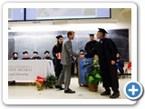 Department Chair Wolfgang Rudolph congratulates Benjamin L. Reichelt, winner of the Feynman Award for Best Student in Contemporary Physics. He won a complete set of the Feynman Lectures on Physics