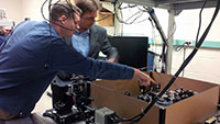 Keith Lidke, PhD, explains his current research to Senator Heinrich in the Lidke Lab 